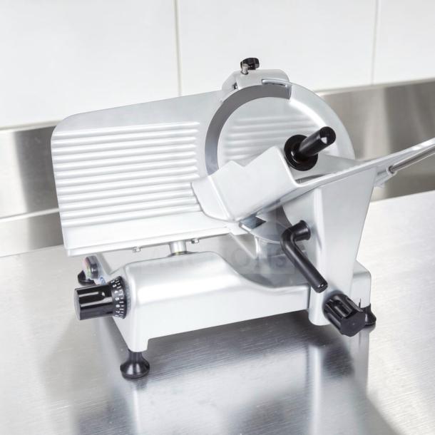 Globe G12 12" commercial manual meat slicer, elite condition, 1/2 HP, heavy-duty gravity feed, fully tested, stainless steel.