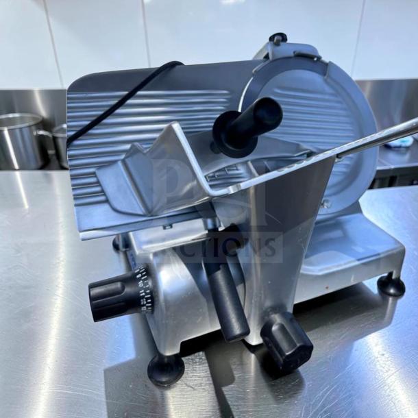 Elite condition Globe G12 12" manual meat slicer by Globe Food Equipment Co., 1/2 HP, heavy-duty, fully tested, operational.