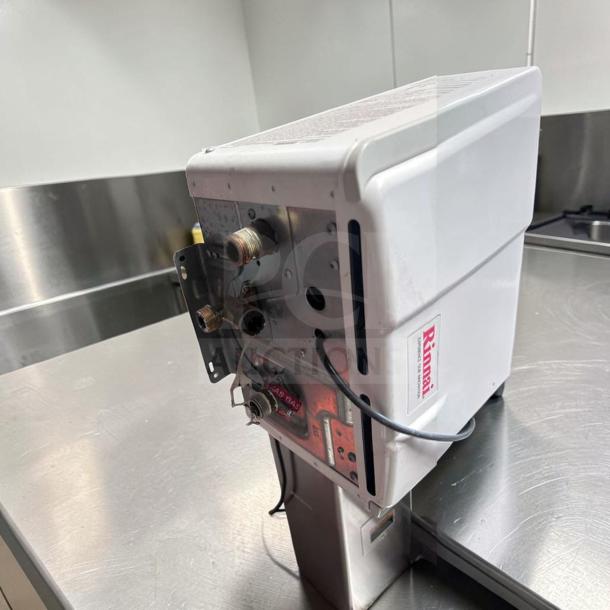 Rinnai V75iN tankless water heater in exceptional condition, 7.5 GPM, 180,000 BTU, natural gas, indoor model, high efficiency.