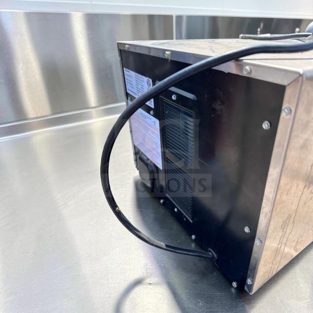 Amana MDC182 Menumaster Commercial Microwave, 1800W, rear view. Black casing, power cord visible, excellent condition.