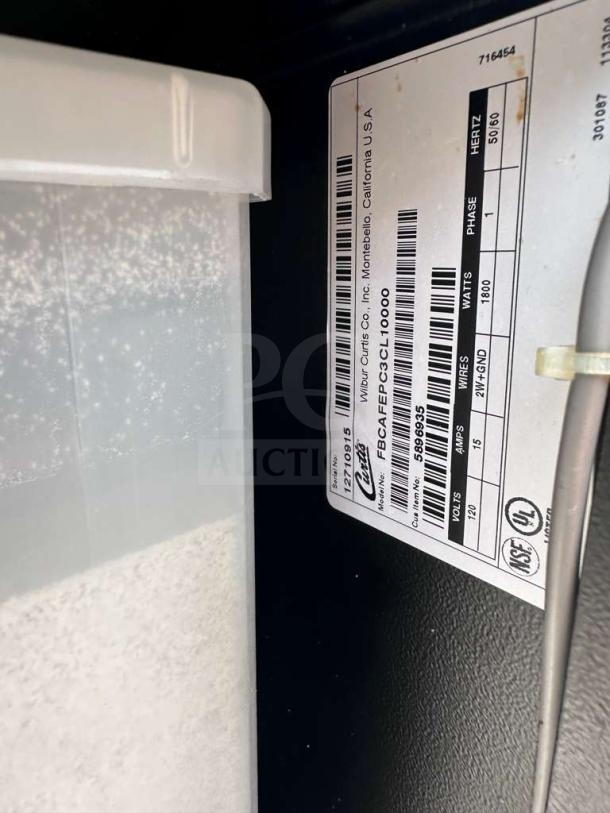 Curtis CAFEPC3CS10000 beverage dispenser label showing model, voltage, and certification details.