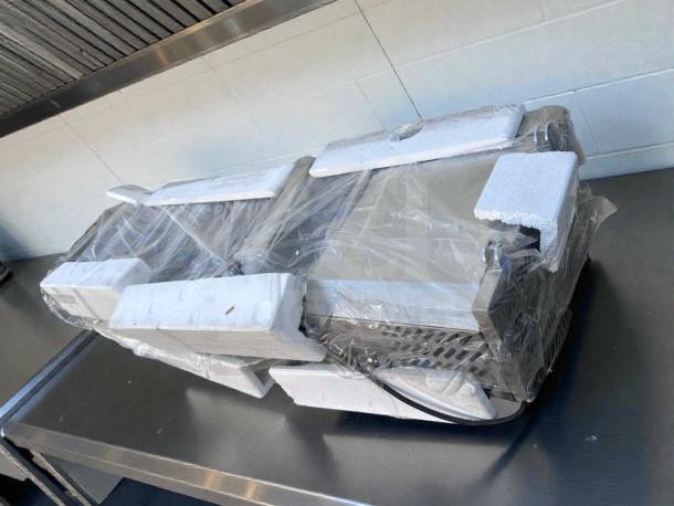 Brand new KoolMore refrigerated cold food well, 6-pan capacity, stainless steel, UL listed, in original packaging.