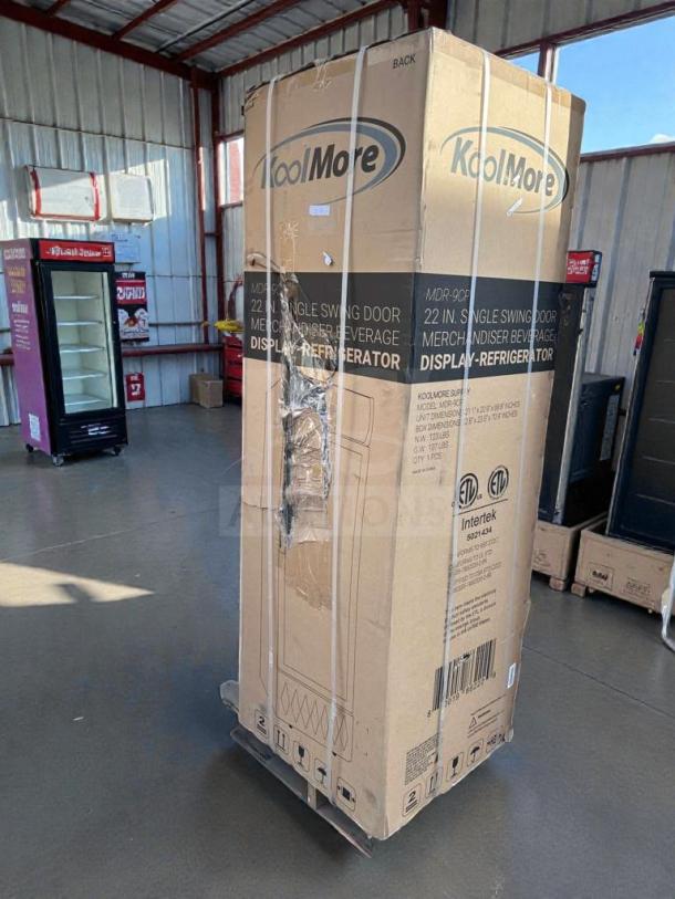 KoolMore MDR-9CP Electric Merchandiser Refrigerator, brand new in box, 9 Cu. Ft., scratch & dent condition, model markings visible.