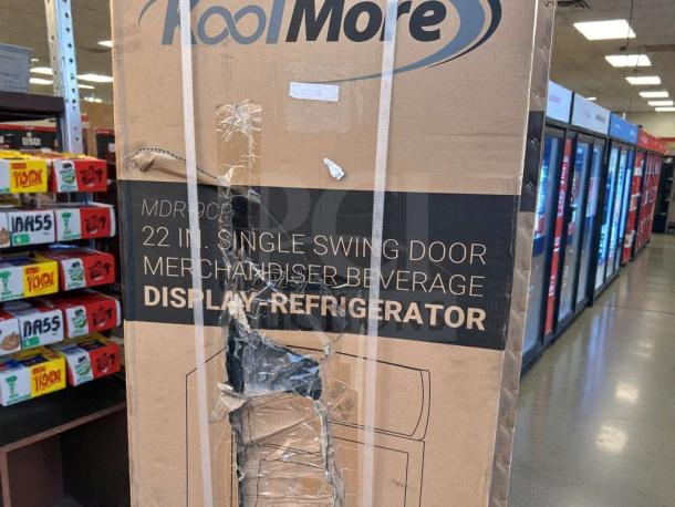 KoolMore MDR-9CP electric merchandiser fridge in box, new with visible packaging damage. 9 Cu. Ft. capacity. Model: KML-L-Ref-0036.