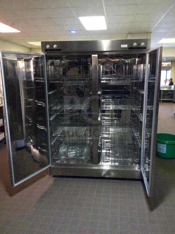 Superior Condition XDR640-F1A Commercial Stainless Steel Sterilizer Cabinet, fully tested, open doors showing interior shelves.