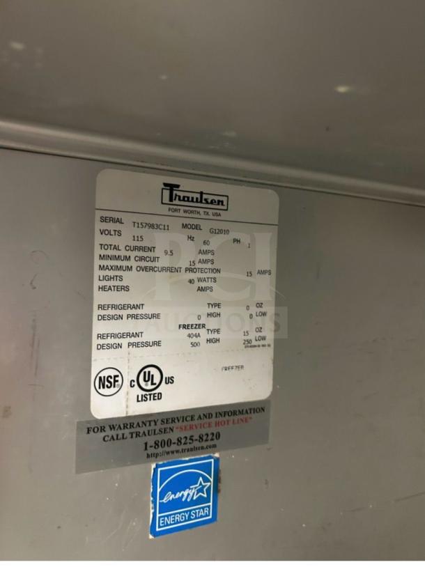 Traulsen G12010 commercial freezer label showing model number, serial number, voltage, and Energy Star certification.