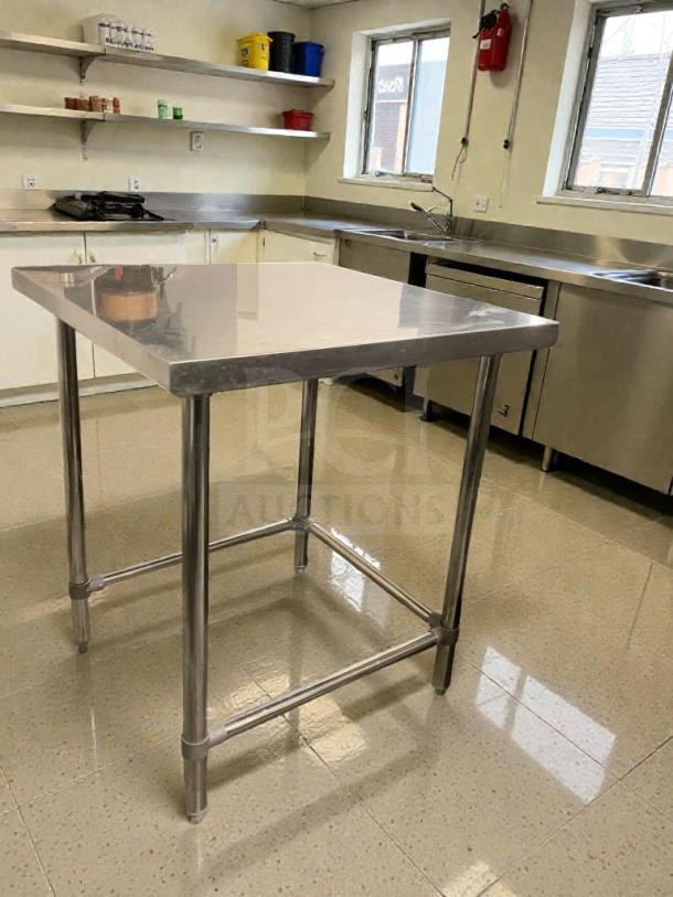 Stainless steel commercial prep table in superb condition, heavy-duty design, model SST-S-PREP-0064, inspected and ready for use.
