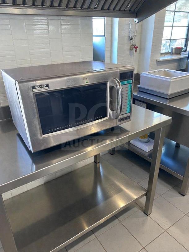 Sharp R-21LV commercial microwave, 1000W, stainless steel, excellent condition, fully tested, visible control panel.