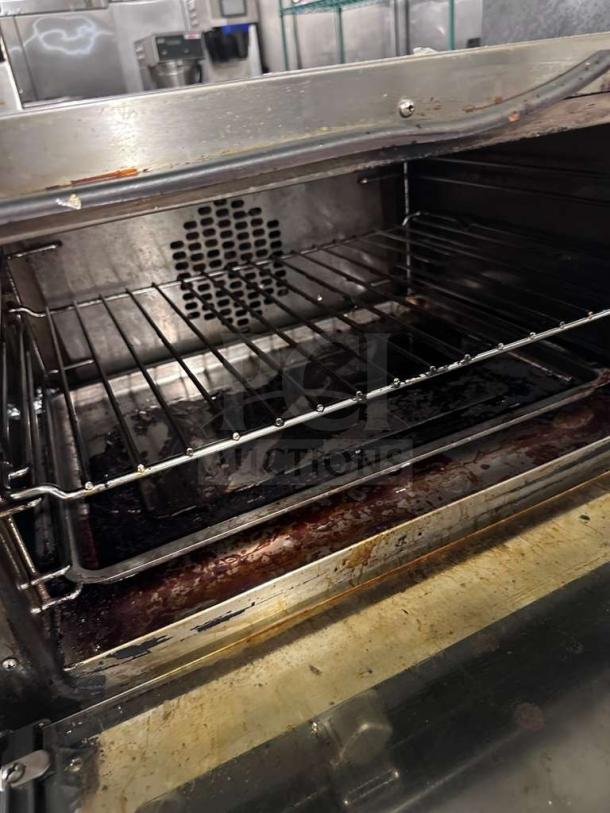 Cadco OV-013/XAF-013-US convection oven, NSF & UL listed, fully operational, interior view showing racks and fan.