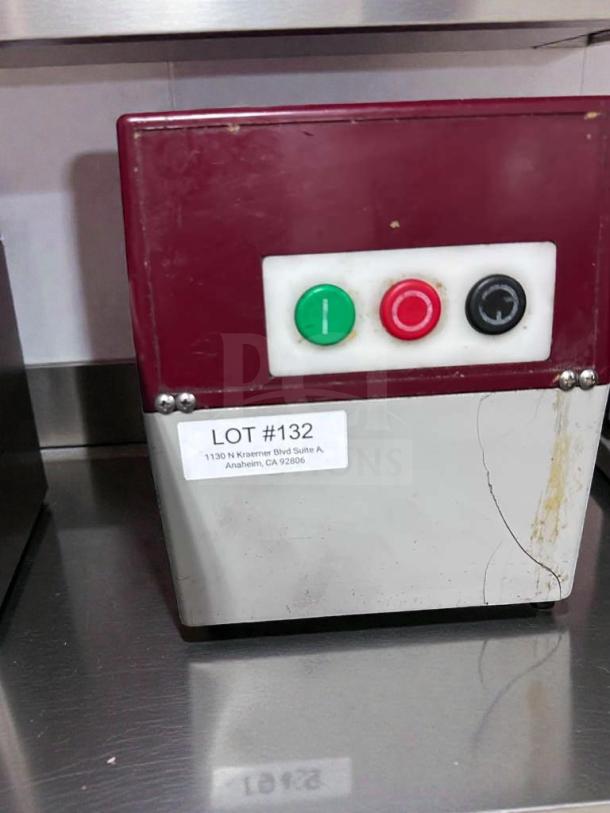 Commercial food processor with control panel, featuring green, red, and black buttons. NSF approved, excellent condition. Lot #132 label visible.
