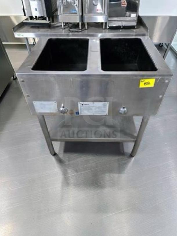 Commercial Food Equipment stainless steel dual well electric hot food table. Features two wells, model STEAM-M-HT-0535, tested and operational.
