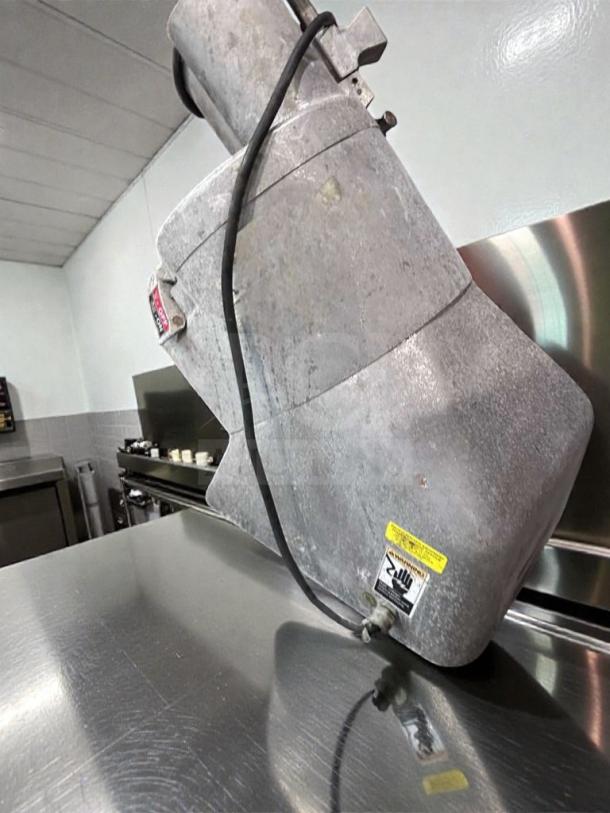 General Slicing/Red Goat commercial vegetable slicer, heavy-duty, NSF certified, tested operational, with visible safety warning labels.