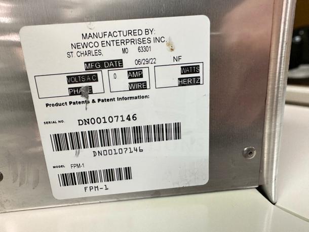 Newco FPM-1 beverage dispenser label showing model and serial number DN00107146, manufactured 06/29/22. NSF listed.