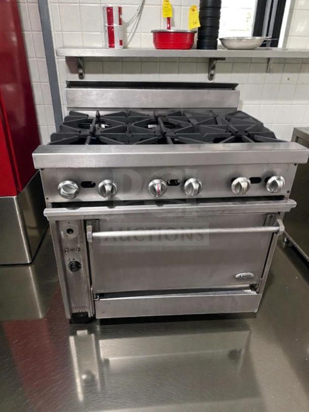 Superior condition Commercial 6 Burner Gas Range with Stainless Steel Oven, model COM-L-RNG-0509, fully operational.