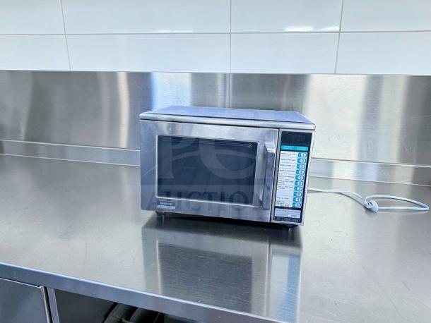 Sharp R-22GT commercial microwave, 1200W, stainless steel, 120V, superb condition, tested operational, visible control panel.
