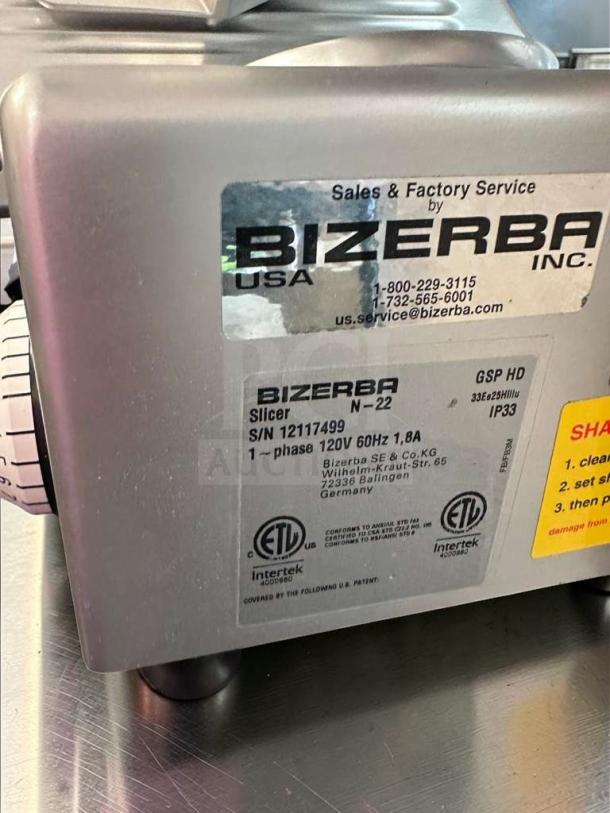 Bizerba N-22 commercial slicer label, indicating model, 120V power, ETL certification, and manufacturer details.