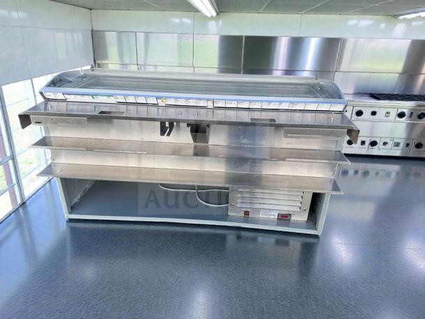 Commercial refrigerated deli display case with glass sneezeguard, excellent condition. Model DEL-L-REF-0576, fully tested.