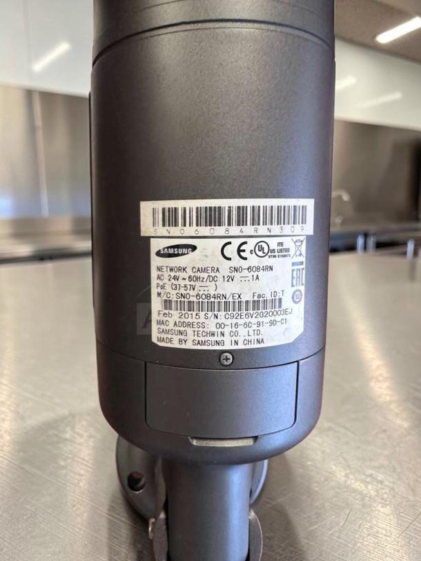 Samsung iPOLIS SNO-6084RN HD Network Bullet Security Camera, superior condition, fully tested, PoE/12V/24V, model details visible.