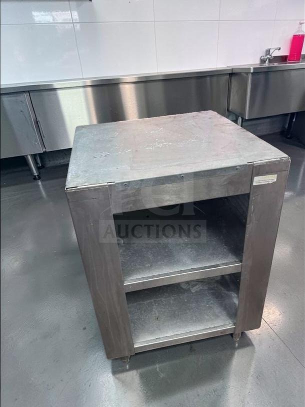 Commercial stainless steel equipment stand, excellent condition, with open shelf storage. Model: COM-S-STD-0687. Heavy-duty, ready for use.
