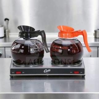 Curtis AW-2-10 dual burner coffee decanter warmer in stainless steel, with "Curtis" and "Decaffeinated Coffee" labels, fully operational.
