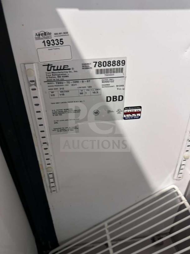 Close-up of a label on a True TSSU-72-30M-B-ST-HC Mega Top Sandwich/Salad Prep Table, indicating model and specifications.