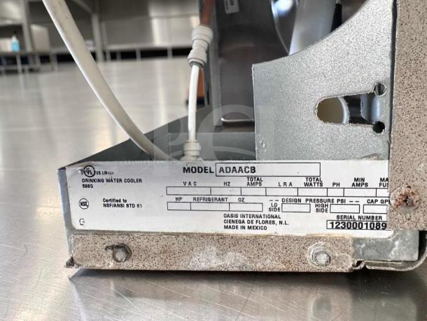 Sunroc ADA8ACB drinking fountain label showing model, certifications, and serial number 1230001089.