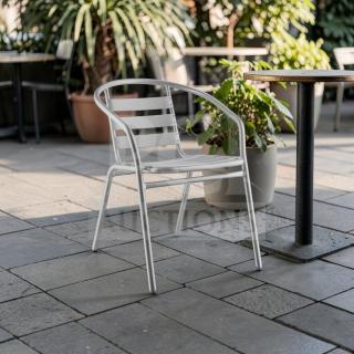 Silver powder-coated Lancaster Table & Seating outdoor arm chair, stackable, commercial grade, in exceptional condition.