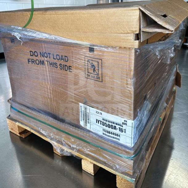 Brand new Manitowoc IYT0500A ice machine in original packaging on a pallet, labeled 550 lb production, 115V/1PH, UL Listed.