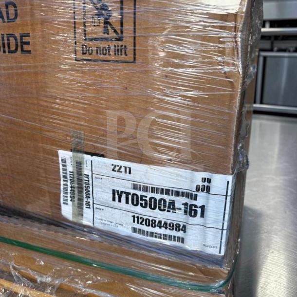 Brand new Manitowoc IYT0500A ice machine in original packaging. Label indicates model and serial number.