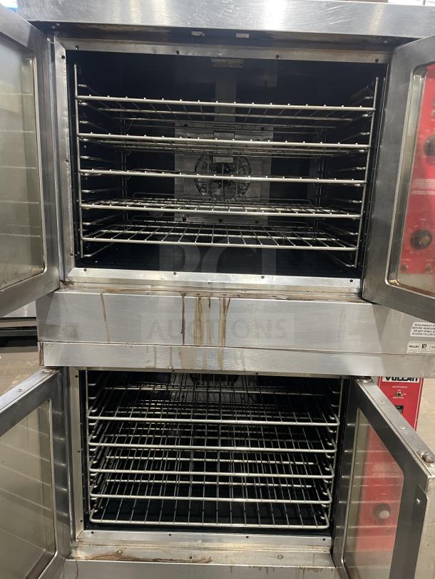 Vulcan VC4GD-10 stainless steel double stacked convection oven on casters, gas-powered, Energy Star certified, with oven racks.
