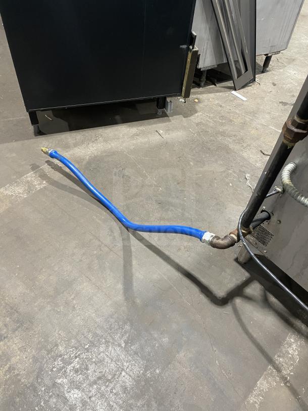 Vulcan VC4GD-10 stainless steel gas convection oven, double stacked, Energy Star certified, with wired rack, on casters.