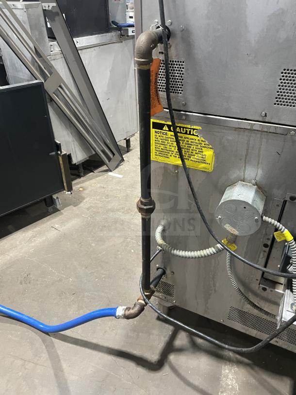 Vulcan VC4GD-10 stainless steel gas convection oven, Energy Star certified, on casters, with wired rack visible.