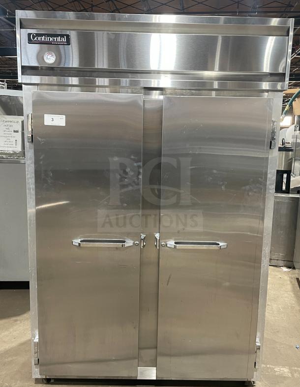 Continental model 2R stainless steel 2-door reach-in refrigerator with poly-coated wire racks, serial 147A2403, on casters.