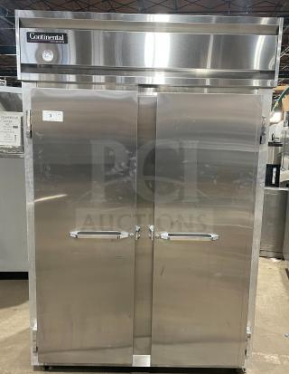 Continental model 2R stainless steel 2-door reach-in refrigerator with poly-coated wire racks, serial 147A2403, on casters.