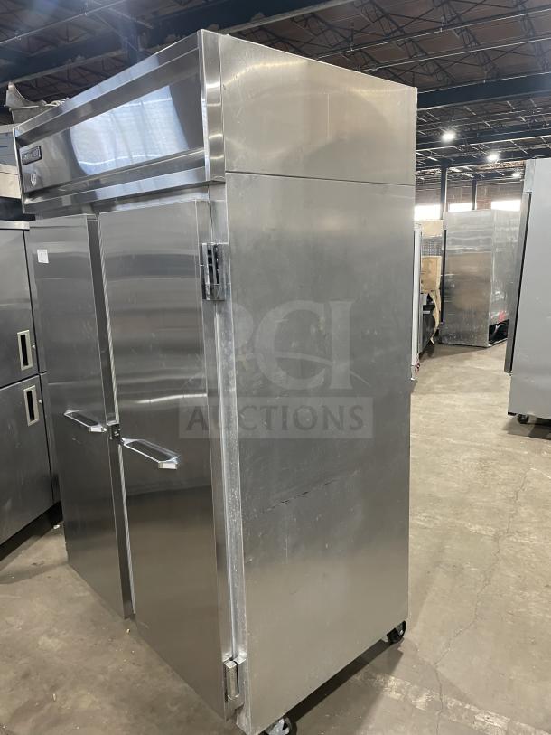 Continental 2R stainless steel 2-door reach-in refrigerator on casters with poly coated wire racks, good condition, model SN: 147A2403.