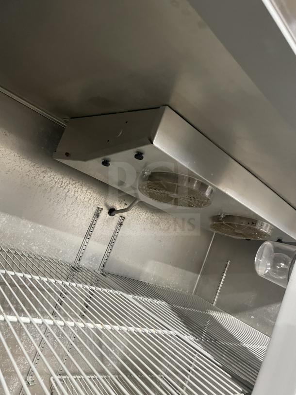 Continental 2R Stainless Steel Refrigerator, poly coated wire racks, on casters, 115V, 1 Phase, 60Hz, SN: 147A2403.