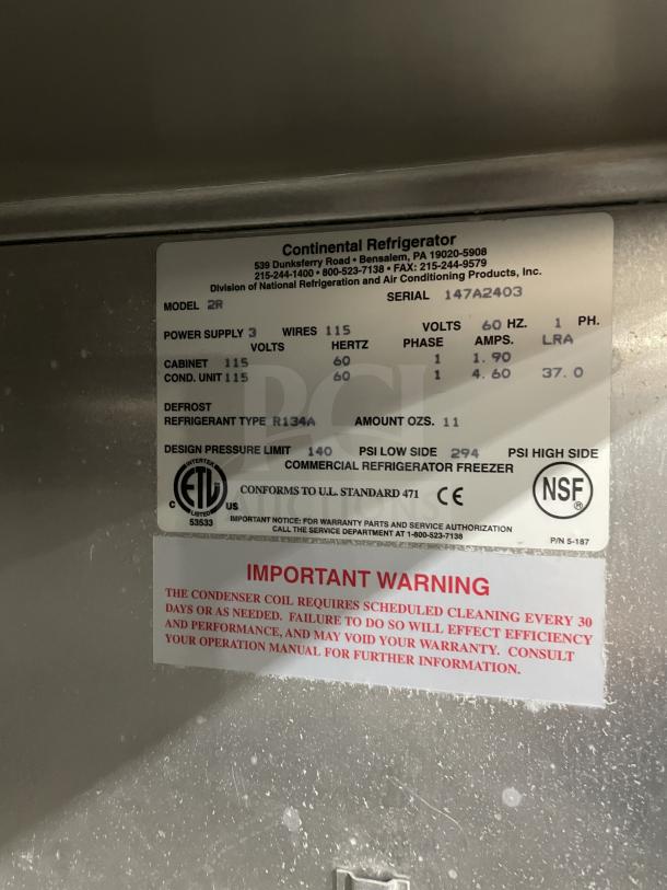 Continental 2R commercial stainless steel 2-door fridge with poly-coated wire racks, 115V, on casters. Serial: 147A2403.