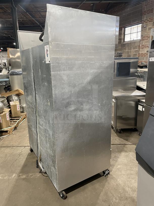 Continental 2R stainless steel 2-door reach-in refrigerator, poly-coated wire racks, on casters, Model 2R, SN: 147A2403.