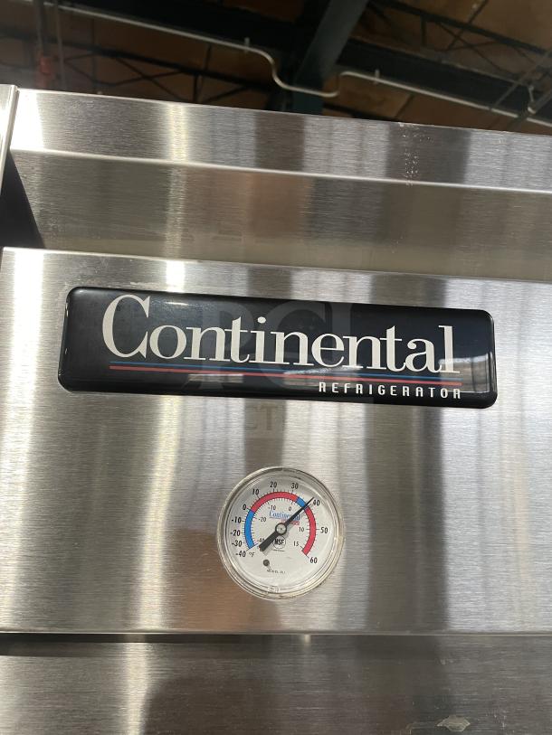 Continental 2R stainless steel 2-door reach-in refrigerator, featuring poly-coated wire racks, temperature gauge, on casters.