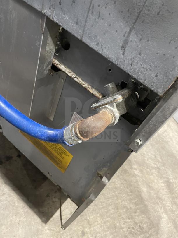 US Range stainless steel natural gas griddle/broiler with 6-burner range, 2 ovens. Model PX-6-24BG-2626. Features visible connection.