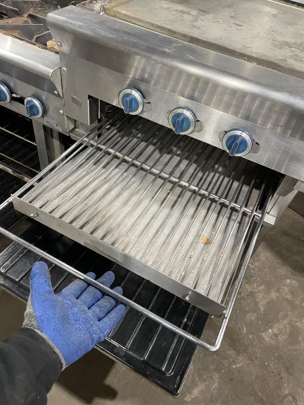 Us Range Model PX-6-24BG-2626 stainless steel natural gas griddle/broiler with 6-burner range, 2 ovens, on casters.