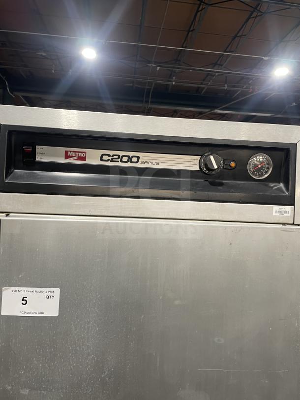 Metro Series C200N stainless steel half-door heated holding cabinet, electric, digital controls, holding racks, on casters.