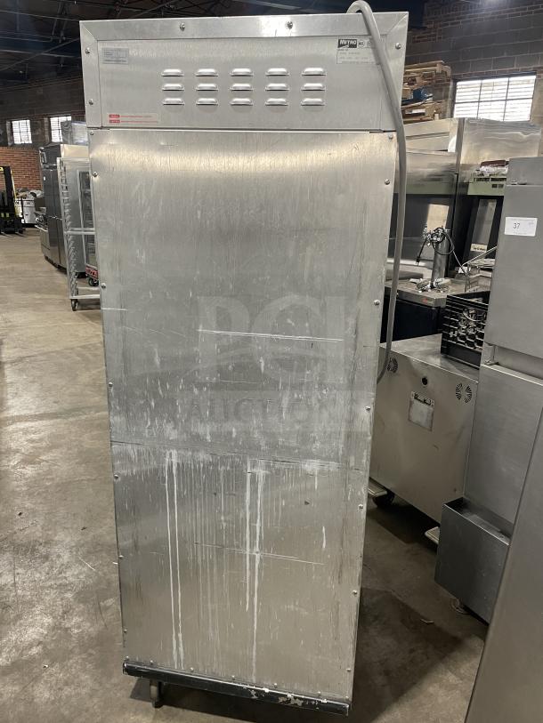 Metro C200N stainless steel heated holding cabinet, half-door, digital controls, on casters, visible wear, commercial use.