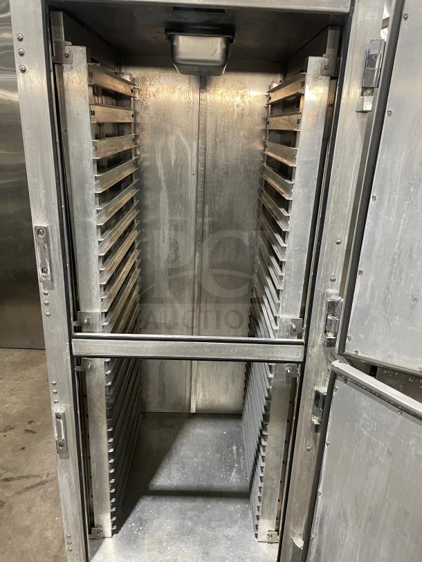 Metro C200N stainless steel half-door heated holding cabinet with digital controls, holding racks, and casters.