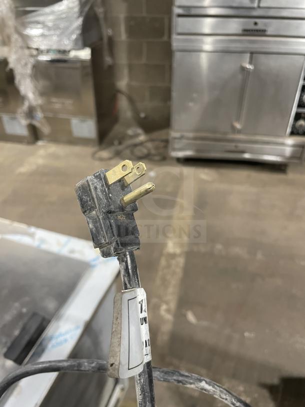 Randell 9552A stainless steel drop-in freezer with power cord, 115V, 60Hz, 1 phase. Model tag visible on cord.