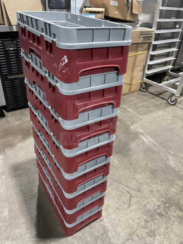 Stack of Cambro 10HS318 commercial dishwasher racks, red and gray, in good condition, showing sturdy build.