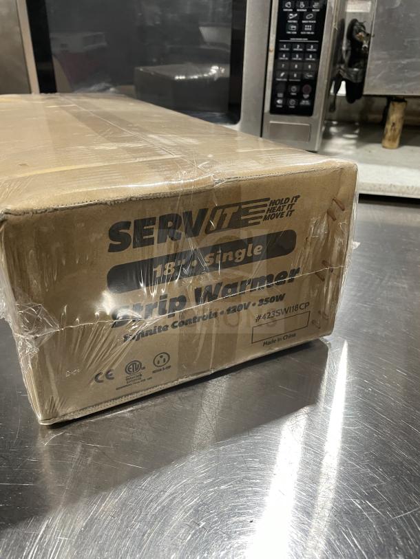 Servit Model 423SWI18CP 18" Single Strip Warmer in packaging. Features infinite controls, 120V, 850W. New condition.