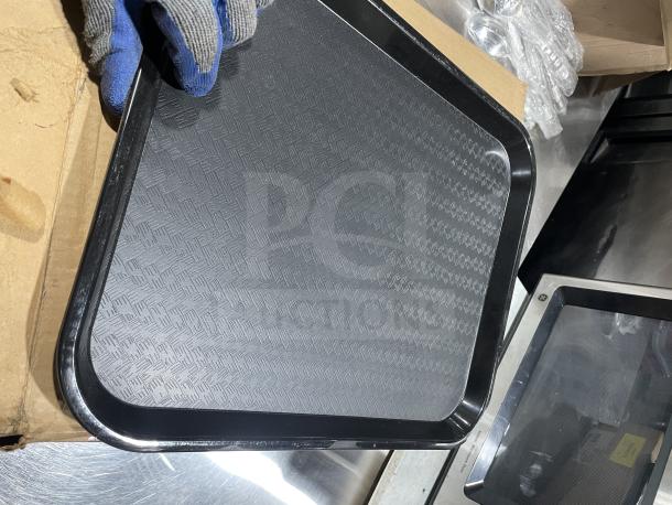 Brand new Carlisle NCT1418 commercial black 14"x18" fast food tray. Textured surface, durable design, 12 trays included.