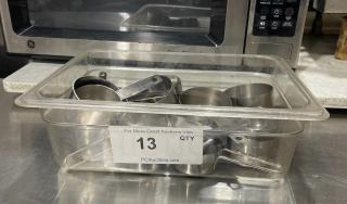 Stainless steel measuring cups in tub, commercial quality, quantity label "13 QTY" from PCIAuctions.com, good condition.