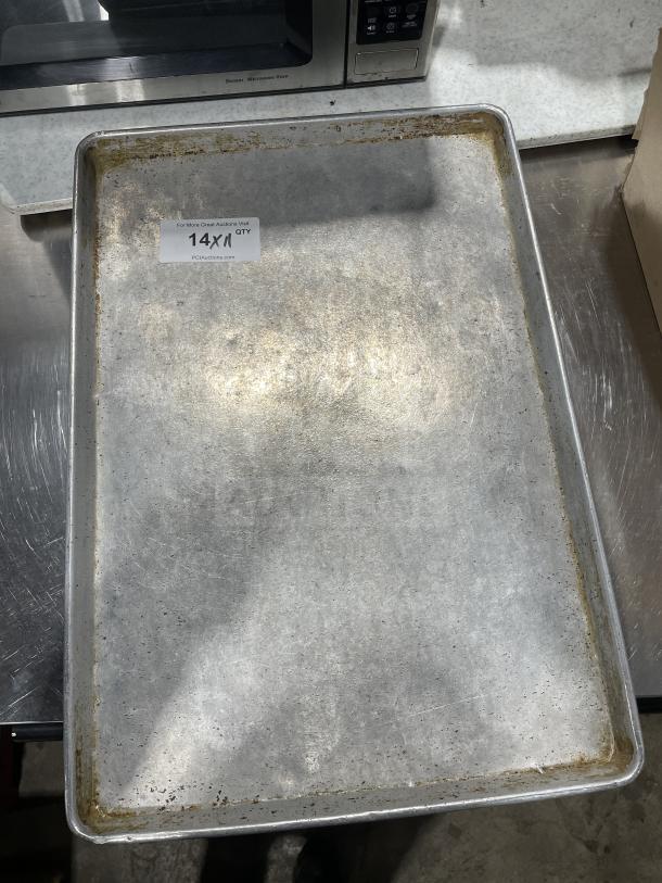 Focus Food Service stainless steel baking sheet, used condition, 14x11 size tag visible, ideal for bulk bidding.